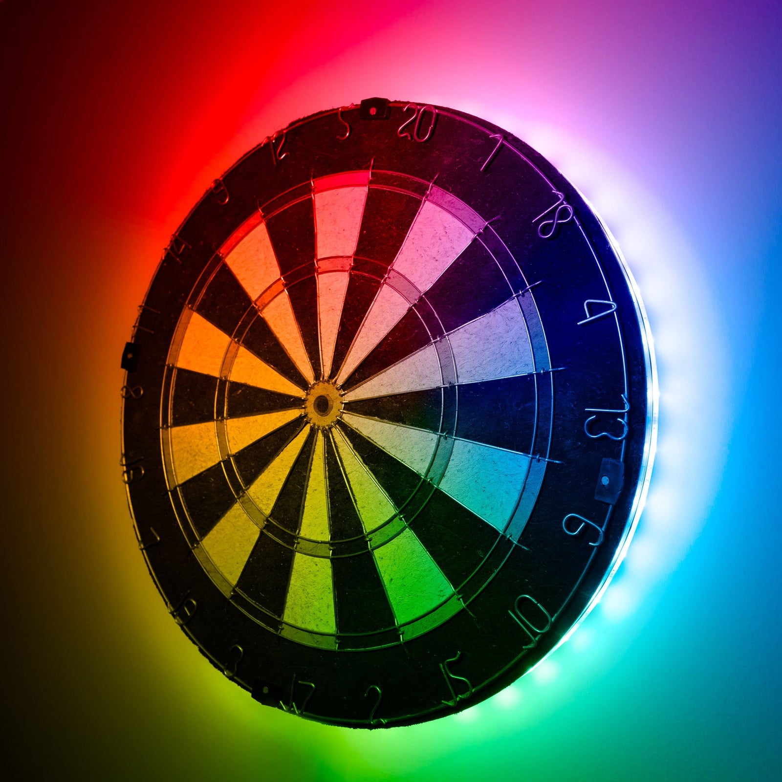 LED lit dart board with a rainbow of colors. 