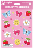 Brightz Reflective Stickers sheet featuring colorful cartoon stickers including blue butterflies, pink bows, red cherries, white flowers, yellow smiley faces, strawberries, peace signs, and stars on a pink background.