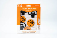 Packaged decorative light string with basketball design on an orange background