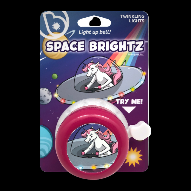 Space Brightz light-up bell with packaging featuring a unicorn in a UFO and rainbow lights.